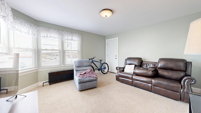 living room with carpet floors and baseboards