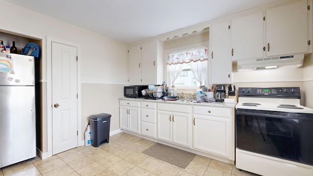kitchen featuring freestanding refrigerator, under cabinet range hood, electric stove, black microwave, and light countertops