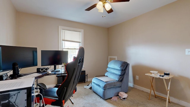 office with a ceiling fan, carpet, and baseboards