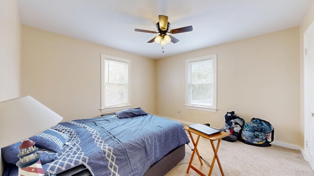 bedroom with baseboards, carpet flooring, and ceiling fan