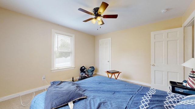 bedroom with baseboards, carpet floors, and ceiling fan