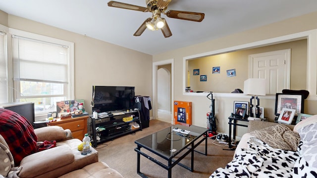 carpeted living room featuring ceiling fan