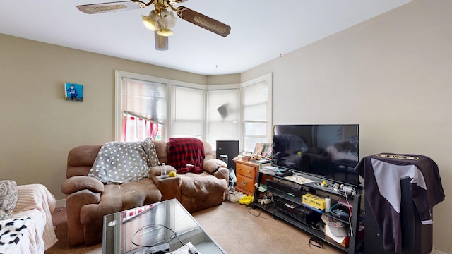 living room with carpet flooring and a ceiling fan