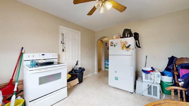 kitchen featuring white appliances, arched walkways, ceiling fan, and concrete floors