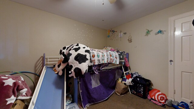 carpeted bedroom with a ceiling fan