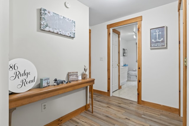 186 Ridge Rd, Frye Island, ME 04071 - hall with light wood finished floors and baseboards