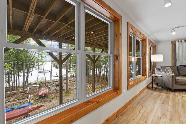 186 Ridge Rd, Frye Island, ME 04071 - sunroom featuring wood finished floors and a water view