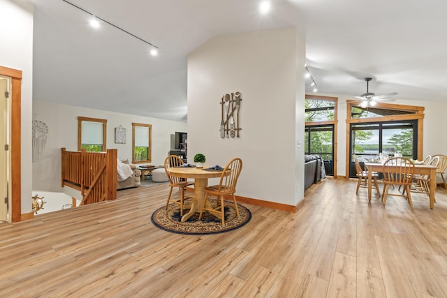 186 Ridge Rd, Frye Island, ME 04071 - dining space featuring lofted ceiling, rail lighting, light wood finished floors, a ceiling fan, and baseboards