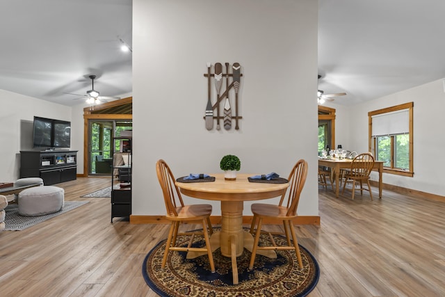 186 Ridge Rd, Frye Island, ME 04071 - dining space featuring a ceiling fan, light wood-type flooring, and baseboards