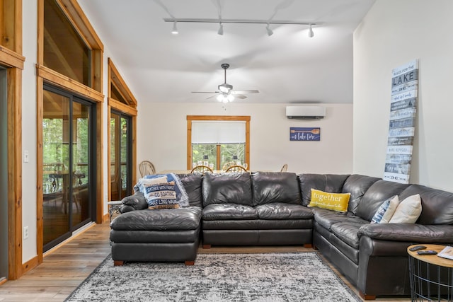 186 Ridge Rd, Frye Island, ME 04071 - living room with track lighting, a wall mounted air conditioner, wood finished floors, and ceiling fan