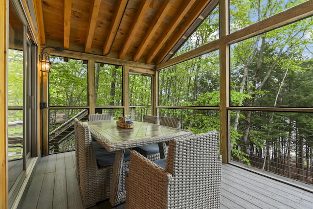 186 Ridge Rd, Frye Island, ME 04071 - unfurnished sunroom featuring outdoor dining space, lofted ceiling, and view of wooded area