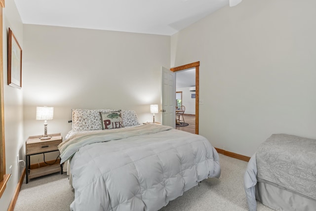 186 Ridge Rd, Frye Island, ME 04071 - bedroom with vaulted ceiling, carpet flooring, and baseboards