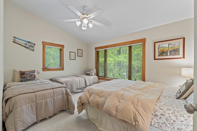 186 Ridge Rd, Frye Island, ME 04071 - bedroom with multiple windows, vaulted ceiling, carpet floors, and a ceiling fan