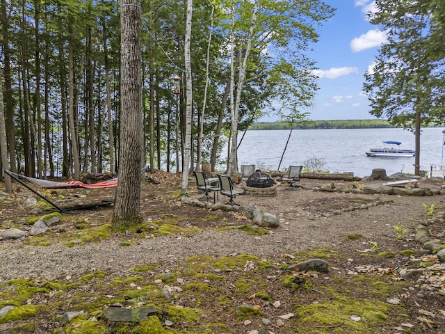 186 Ridge Rd, Frye Island, ME 04071 - view of yard with a fire pit and a water view