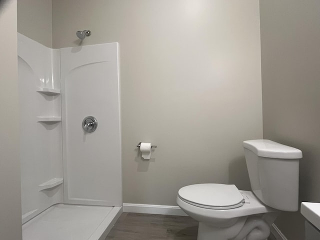 10 W Bates St, Auburn, ME 04210 - full bath with toilet, baseboards, a shower, and wood finished floors