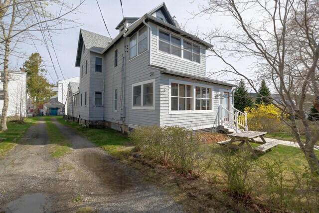 6 Sea St, Northeast Harbor, Mount Desert, ME 04662 - view of side of property with a shingled roof
