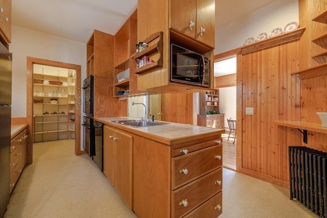 6 Sea St, Northeast Harbor, Mount Desert, ME 04662 - kitchen featuring open shelves, tile countertops, black appliances, a sink, and wooden walls