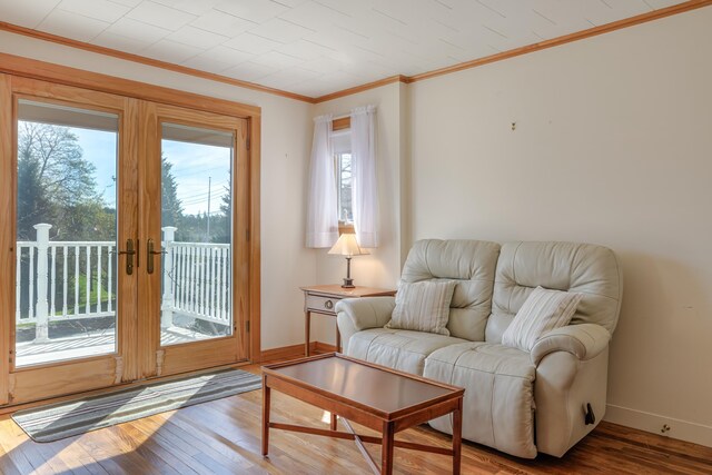 6 Sea St, Northeast Harbor, Mount Desert, ME 04662 - living area featuring plenty of natural light, hardwood / wood-style floors, ornamental molding, baseboards, and french doors