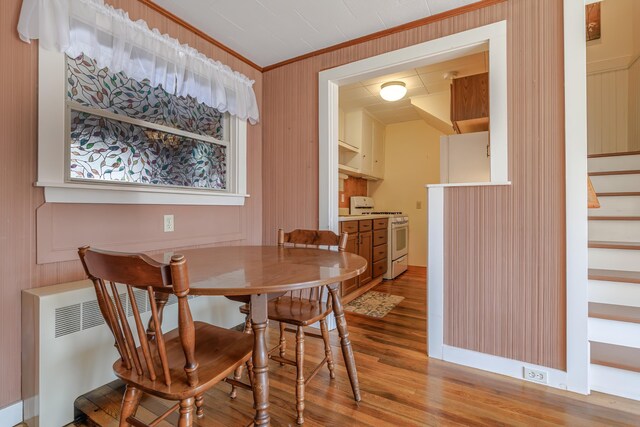 6 Sea St, Northeast Harbor, Mount Desert, ME 04662 - dining room with light wood-style flooring, stairway, and crown molding