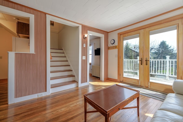 6 Sea St, Northeast Harbor, Mount Desert, ME 04662 - living area featuring ornamental molding, radiator heating unit, stairs, french doors, and wood finished floors
