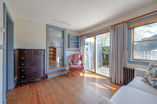 6 Sea St, Northeast Harbor, Mount Desert, ME 04662 - living area featuring radiator, wood-type flooring, and plenty of natural light