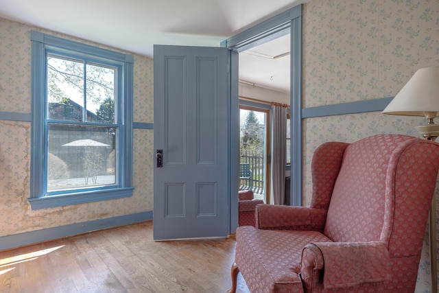 6 Sea St, Northeast Harbor, Mount Desert, ME 04662 - living area with wood finished floors, wallpapered walls, and plenty of natural light