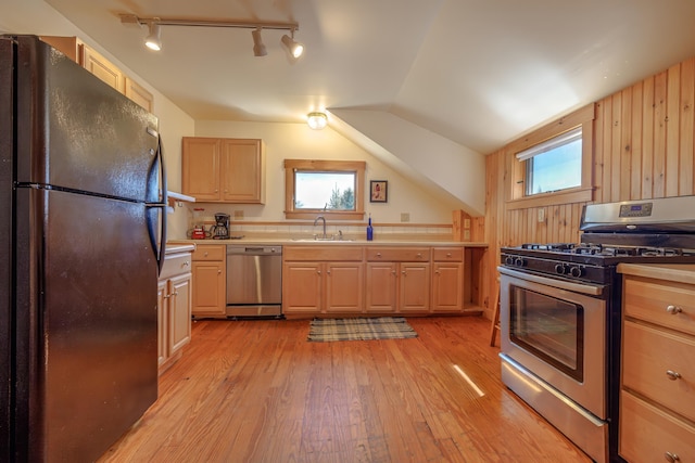 6 Sea St, Northeast Harbor, Mount Desert, ME 04662 - kitchen featuring appliances with stainless steel finishes, a sink, rail lighting, light wood-style flooring, and light countertops