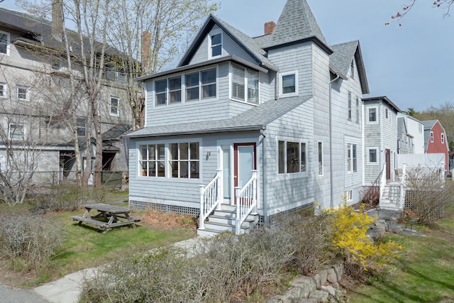 6 Sea St, Northeast Harbor, Mount Desert, ME 04662 - view of front of house with entry steps, roof with shingles, fence, and a chimney