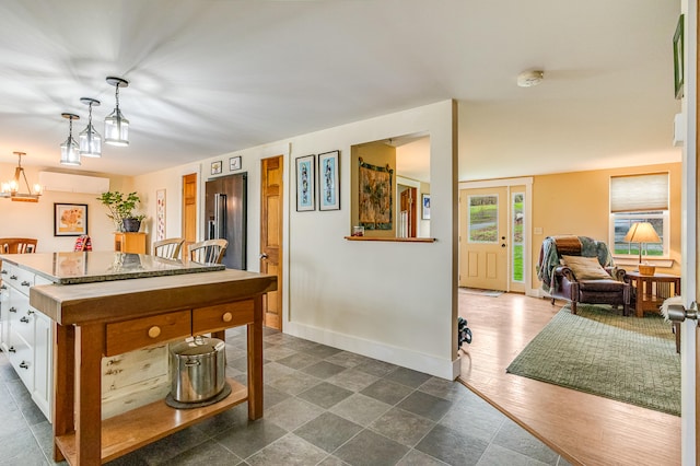 recreation room with baseboards