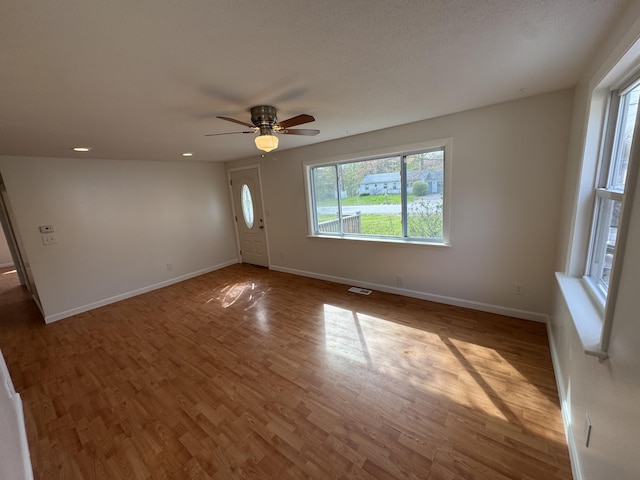 29 Faith St, Lisbon, ME 04252 - spare room with wood finished floors, baseboards, ceiling fan, and recessed lighting
