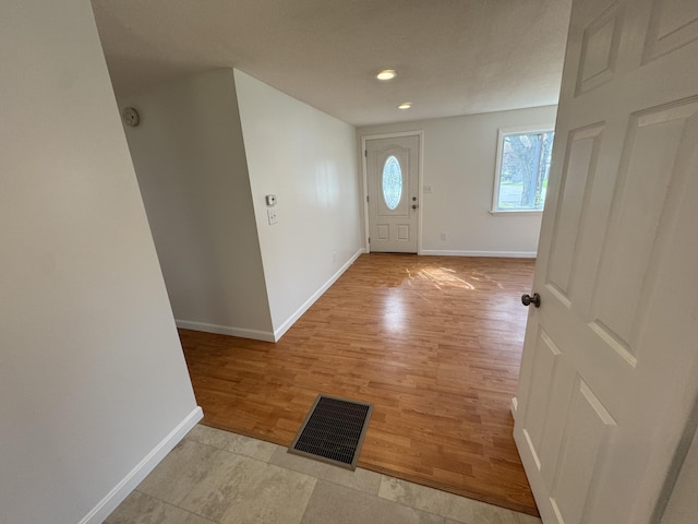 29 Faith St, Lisbon, ME 04252 - entrance foyer featuring baseboards, light wood-type flooring, and recessed lighting