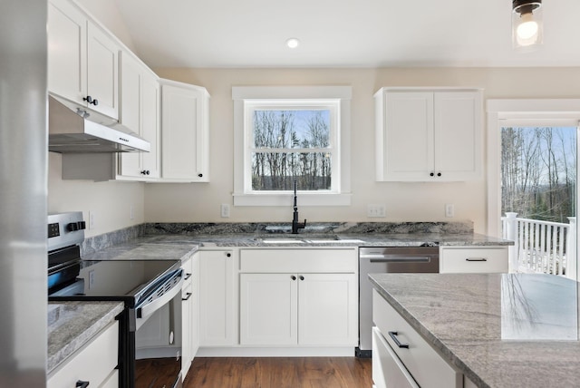 1540 Foxes Ridge Rd, Acton, ME 04001 - kitchen with stainless steel appliances, under cabinet range hood, a sink, light stone countertops, and white cabinets