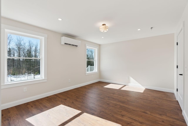 1540 Foxes Ridge Rd, Acton, ME 04001 - unfurnished room with a wall mounted air conditioner, wood finished floors, baseboards, recessed lighting, and a pendent fire sprinkler