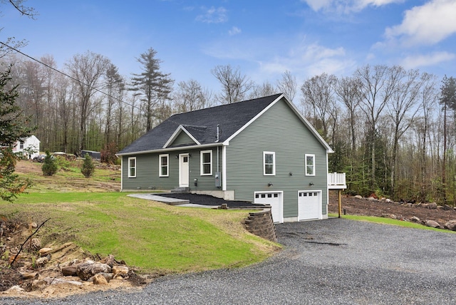 1540 Foxes Ridge Rd, Acton, ME 04001 - view of front of home featuring an attached garage, gravel driveway, roof with shingles, and a front lawn