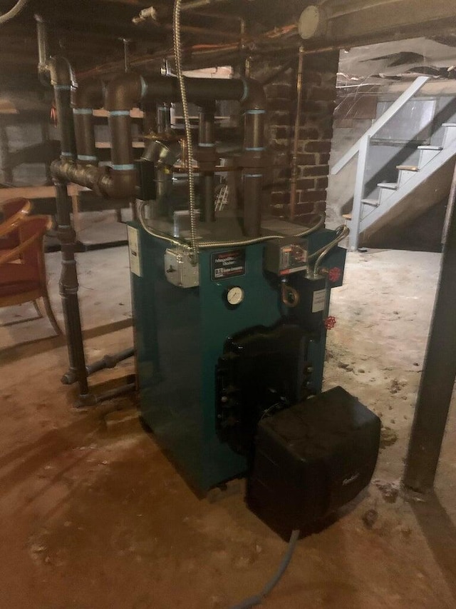 91 Elm St, Millinocket, ME 04462 - utility room featuring a heating unit