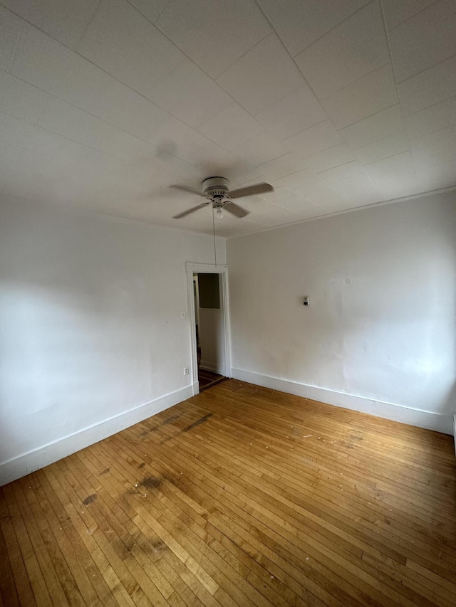 91 Elm St, Millinocket, ME 04462 - unfurnished room featuring a ceiling fan, hardwood / wood-style flooring, and baseboards