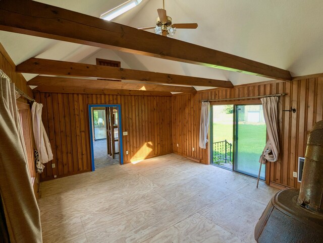 99 W Hamlet Rd, Newcastle, ME 04553 - unfurnished living room with wooden walls, healthy amount of natural light, and a ceiling fan