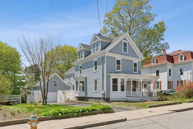 244 Concord St W, Portland, ME 04103 - view of front of house featuring covered porch, a detached garage, and fence