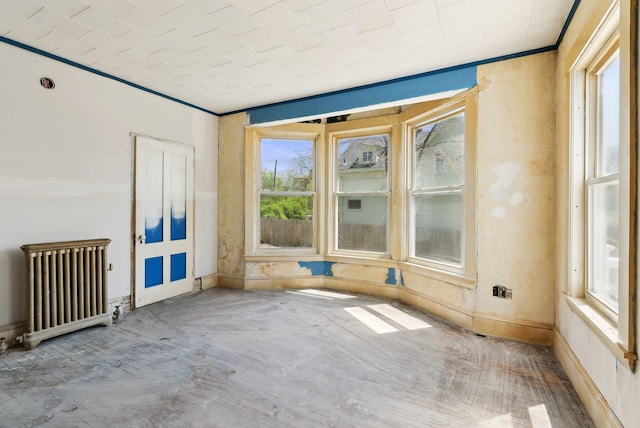 244 Concord St W, Portland, ME 04103 - empty room with radiator, baseboards, and ornamental molding