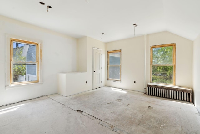 244 Concord St W, Portland, ME 04103 - unfurnished room with radiator heating unit and vaulted ceiling