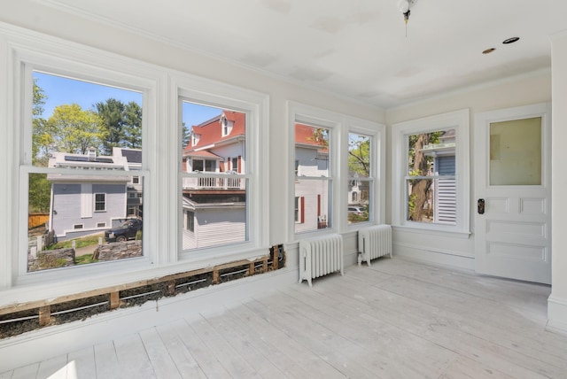 244 Concord St W, Portland, ME 04103 - sunroom / solarium with radiator heating unit and healthy amount of natural light