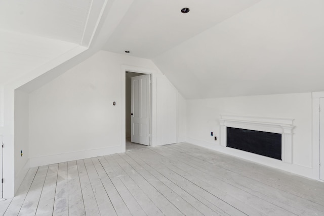 244 Concord St W, Portland, ME 04103 - bonus room featuring lofted ceiling, light wood-style floors, a fireplace, and baseboards