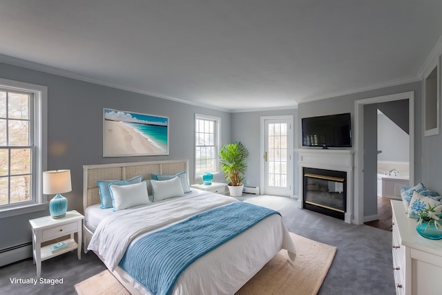 9 Ocean View Cir, Saco, ME 04072 - bedroom with crown molding, carpet, access to exterior, a glass covered fireplace, and a baseboard heating unit