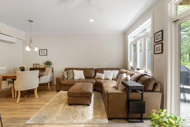 25 Preservation Ln Unit 9, South Portland, ME 04106 - living room with light wood finished floors, ornamental molding, a ceiling fan, a wall mounted air conditioner, and recessed lighting