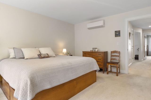 25 Preservation Ln Unit 9, South Portland, ME 04106 - bedroom featuring a wall mounted AC, light colored carpet, and baseboards
