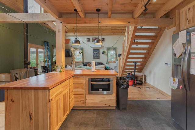 26 Christen Rd, Kingfield, ME 04947 - kitchen with wood counters, appliances with stainless steel finishes, beamed ceiling, decorative light fixtures, and wood ceiling