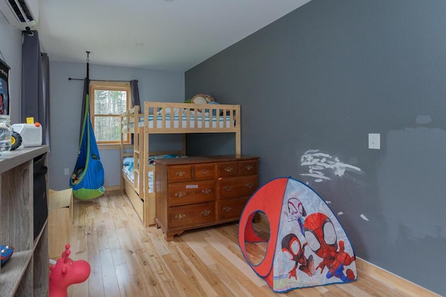 26 Christen Rd, Kingfield, ME 04947 - bedroom featuring light wood-style floors, a wall mounted AC, and baseboards