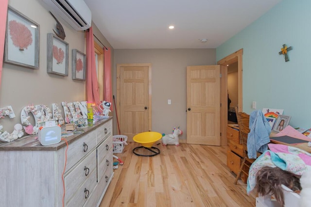 26 Christen Rd, Kingfield, ME 04947 - bedroom with a wall unit AC, light wood-style floors, and recessed lighting