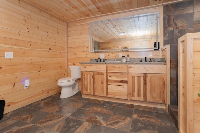 26 Christen Rd, Kingfield, ME 04947 - bathroom featuring wood ceiling, stone tile flooring, toilet, wood walls, and double vanity