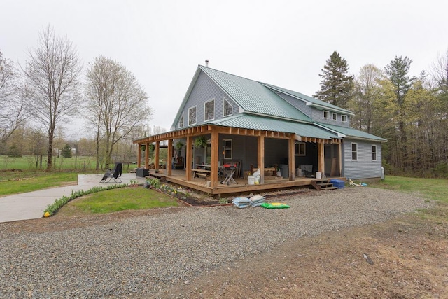 26 Christen Rd, Kingfield, ME 04947 - back of house with metal roof and covered porch